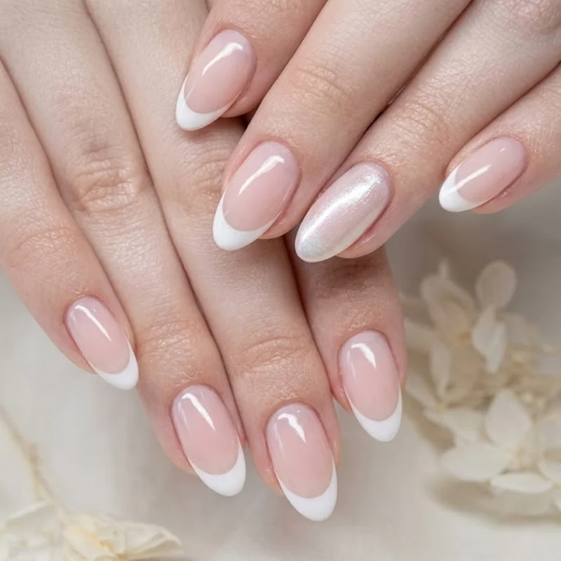 Bridal pearl shimmer accent oval french tip nails for wedding occasion manicure