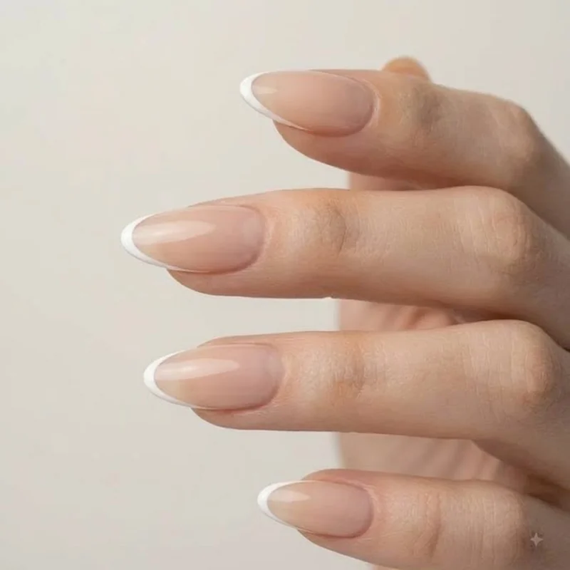 Micro thin line minimalist oval french tip nail design on natural base
