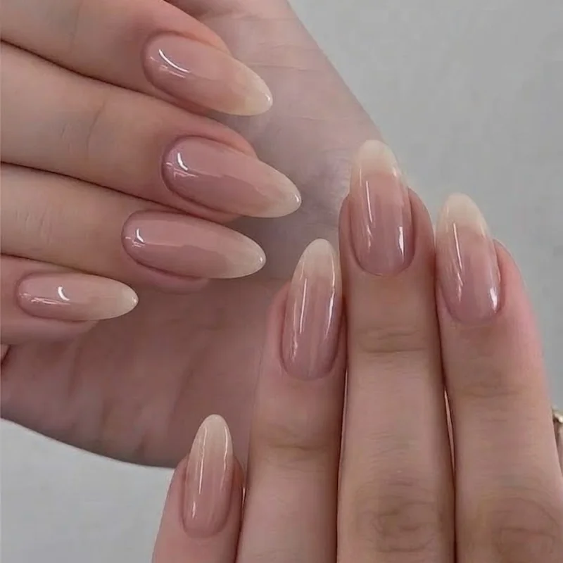 Finished natural oval nails buffed and glossy showing a freshly filed at-home manicure result