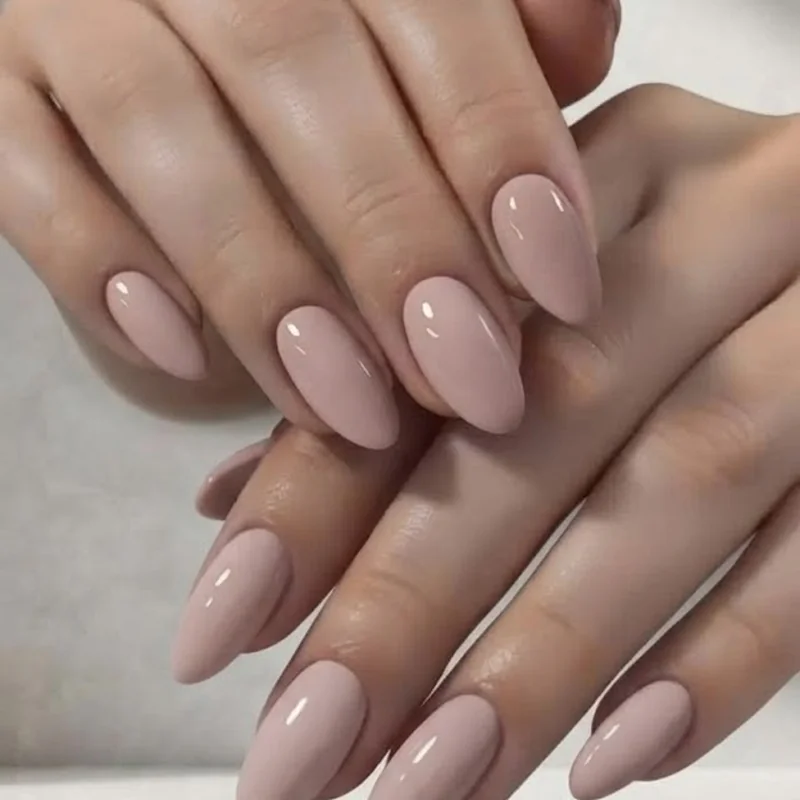 Oval nails on a hand with wider nail beds demonstrating the narrowing and elongating flattery effect