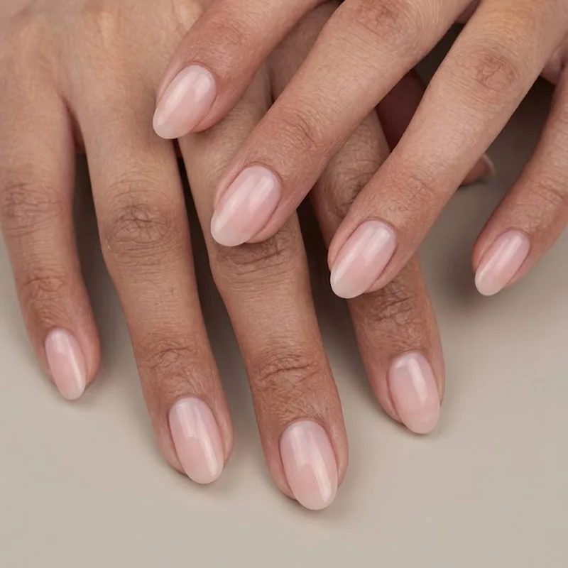 Oval nail shape swap from almond showing rounded tip manicure styled editorial close-up