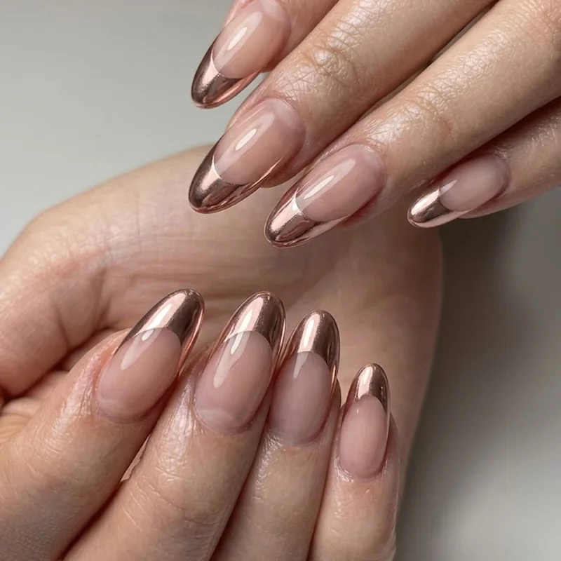 Close up of an oval press on manicure at medium length showing correct flush fit and shape