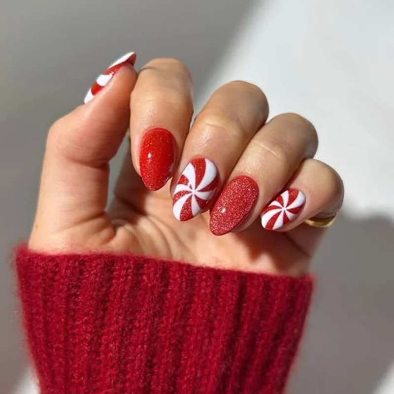 Creative peppermint swirl candy cane nails with curved red and white patterns