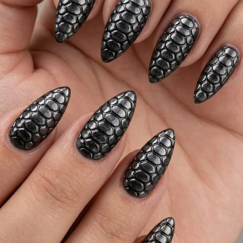 3D textured snake nail art with raised scale pattern on stiletto shape and glossy top coat finish