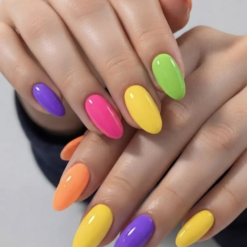 Styled femme queer manicure with party fingers short nails and colorful nail art