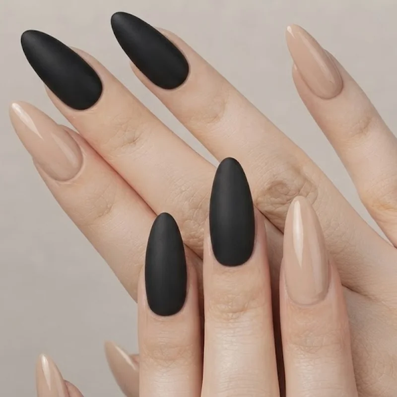 Classic queer manicure with two short nails on index and middle finger, rest long