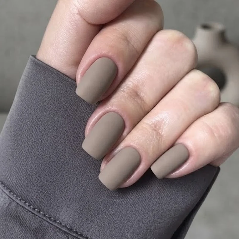 Warm welcoming salon styled finished queer manicure hands close up shot
