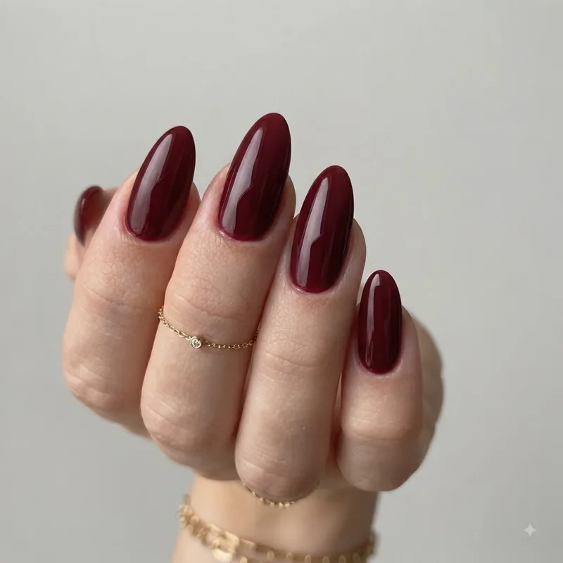 Manicured hand styled with a date night outfit and accessory detail, gold jewellery