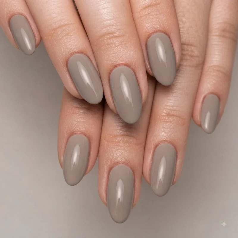 Finished quick manicure in a neutral shade with glossy smudge-free polish on styled hands