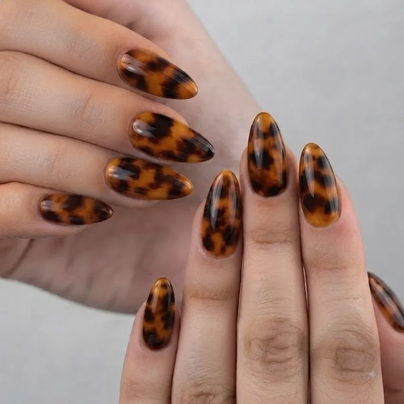 Tortoiseshell late september nails in amber caramel black on almond shape