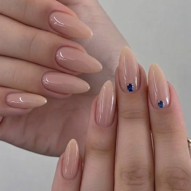 Elegant september birthday nails with minimalist sapphire accent nail on a soft nude base manicure