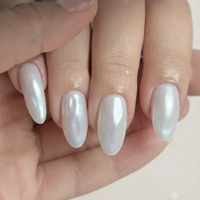 September birthday nails moonstone design with iridescent chrome finish on a milky white base