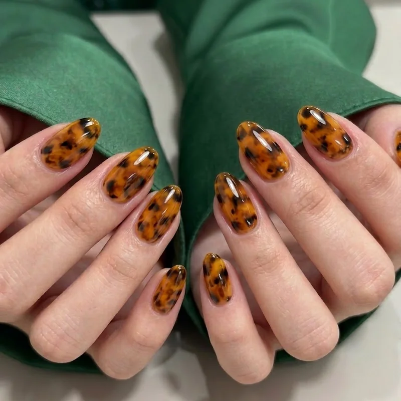 Tortoiseshell hand-painted amber brown manicure detailed artistic september nail art pattern