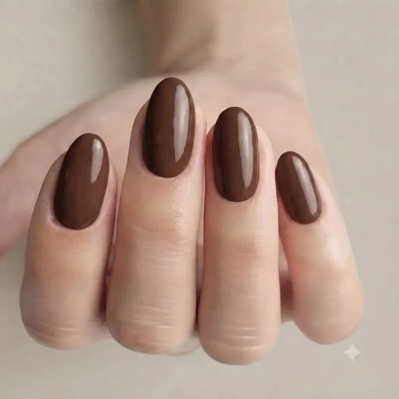 Office appropriate september nail color in glossy chocolate brown with a clean rounded nail shape