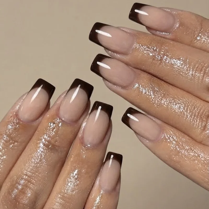 Clean square nail shape manicure shown at a short to medium length, featuring a crisp fall-toned French tip styling detail