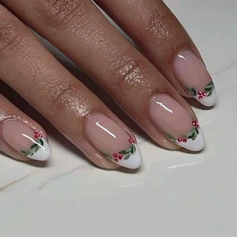 short round christmas nails with nude base and tiny holly berry minimalist nail art natural length