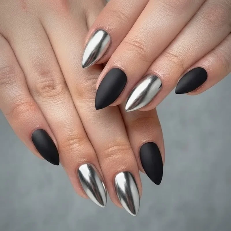 Silver chrome and matte black accent nail combination on one hand with high contrast finish