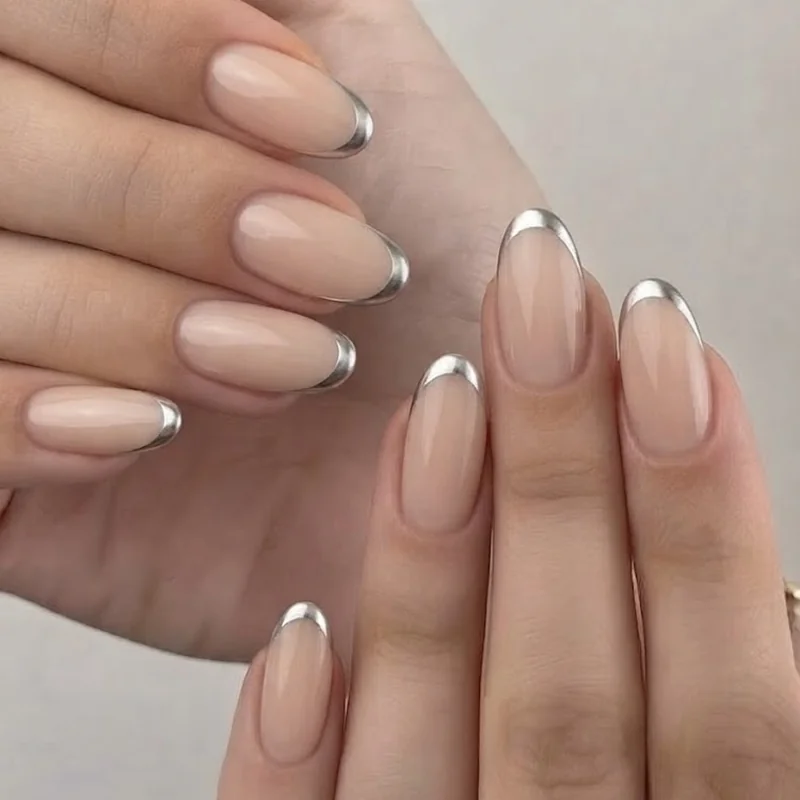 Silver french tip manicure on nude base short to medium length suitable for office wear