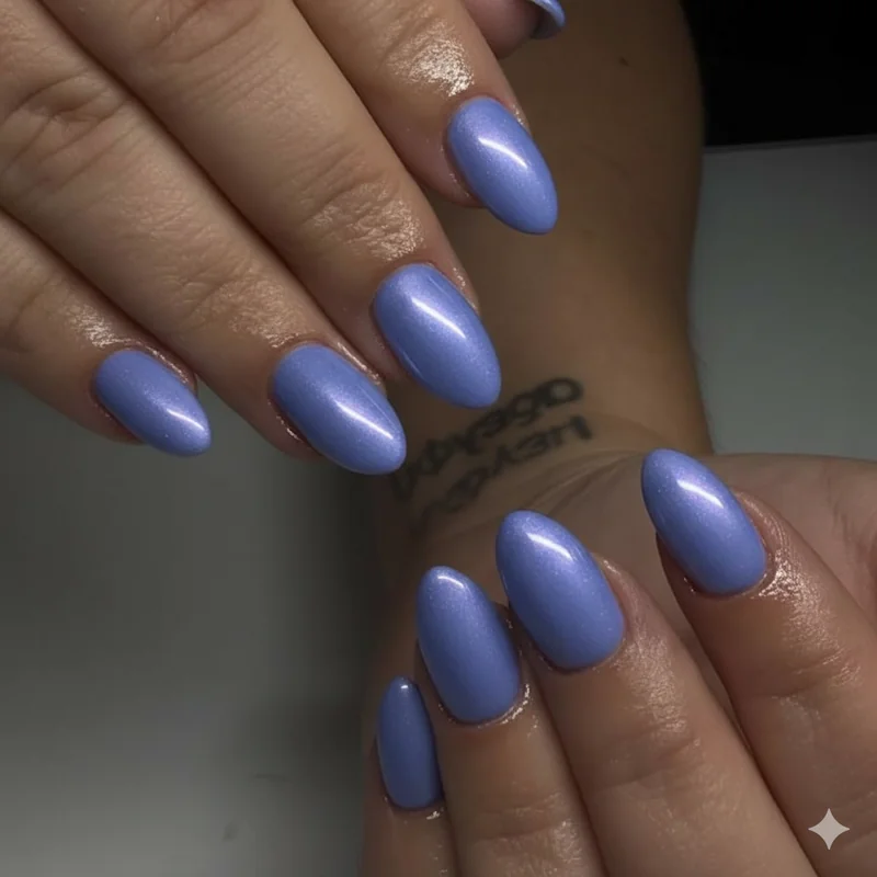 Periwinkle nails with pastel chrome overlay showing blue purple glazed finish on almond shaped nails for spring 2026 season
