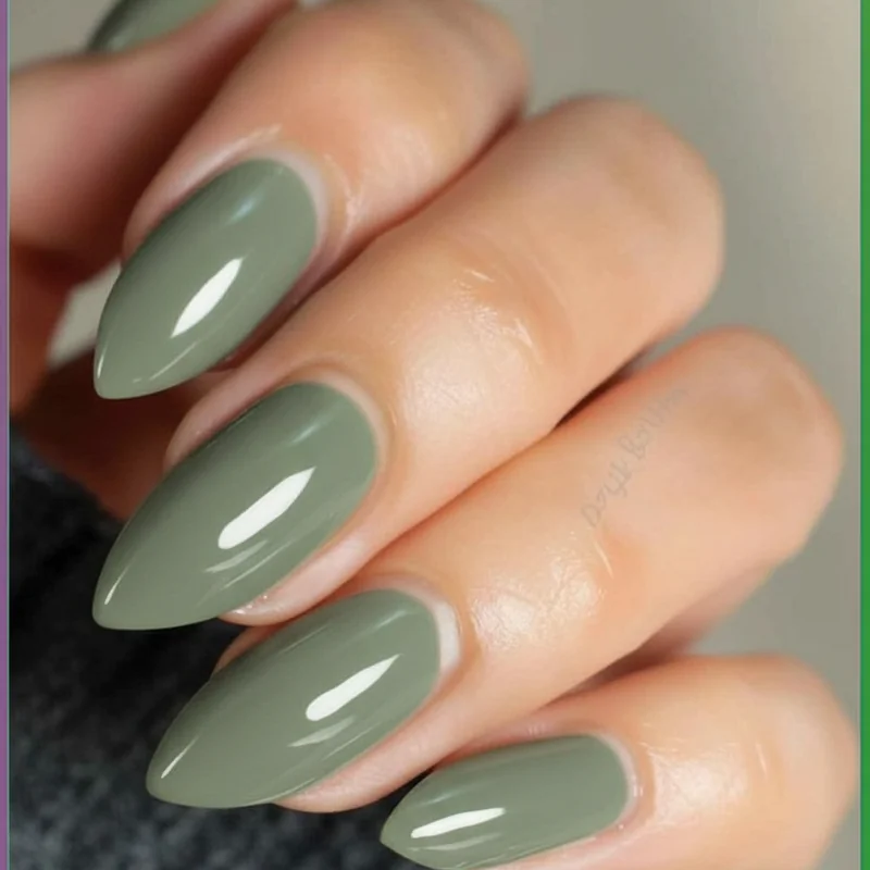Earth green sage jade spring nails 2026 showing Wilderkind grounded tonal manicure on short almond shape with soft natural finish