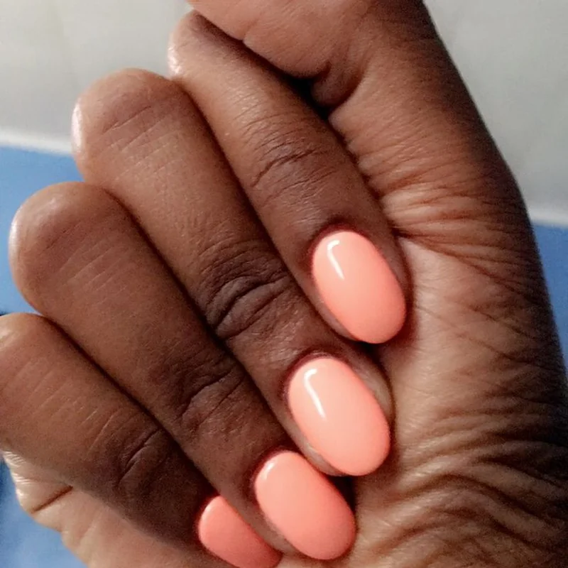 Spring peach and coral nail polish colors with warm undertones flattering mature hands