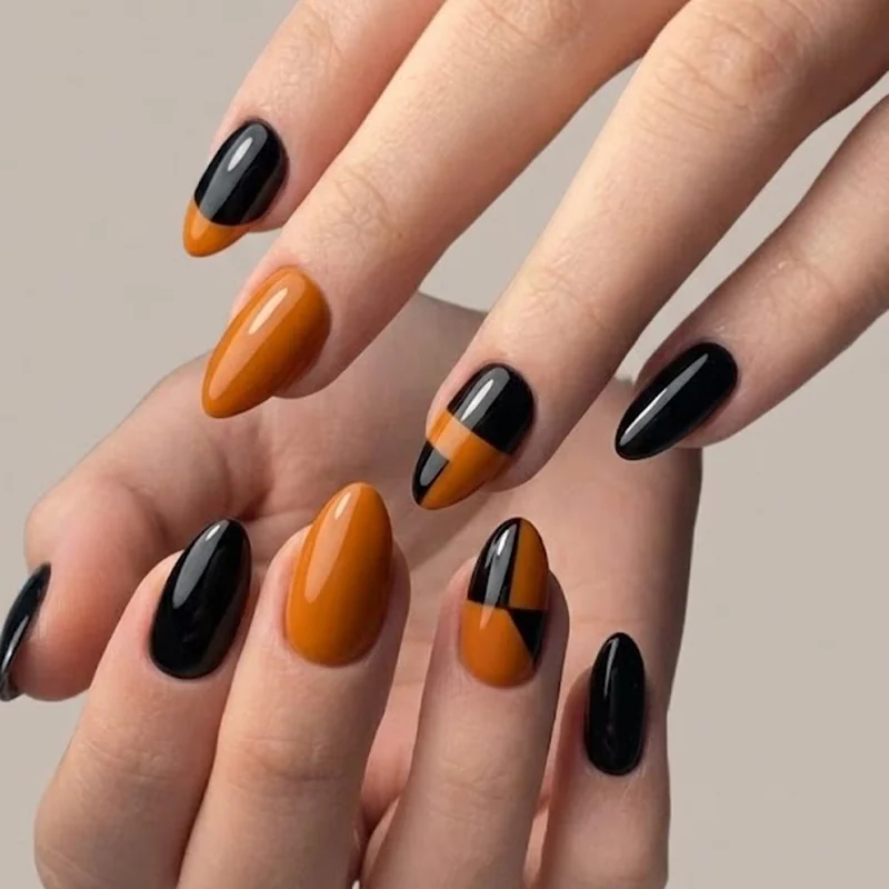Short stiletto Halloween nail set styled in black and orange for one-night wear