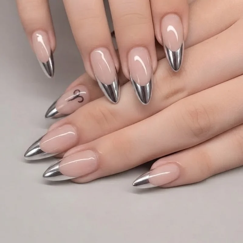 Silver chrome french tip mirror finish on stiletto nail catching light reflection