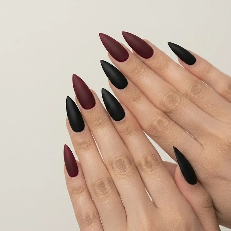 Stiletto nail art ideas featuring fine-line abstract design and marble texture on a medium length set