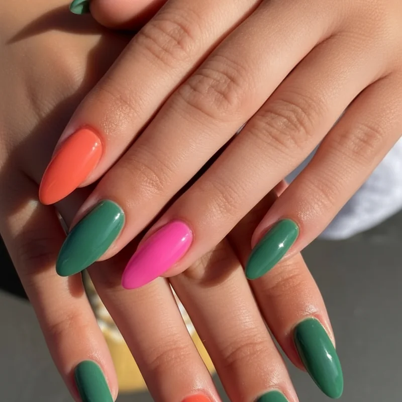 Summer nail colours for medium and olive skin tones showing persimmon orange hot pink and jade green swatches on warm medium complexion