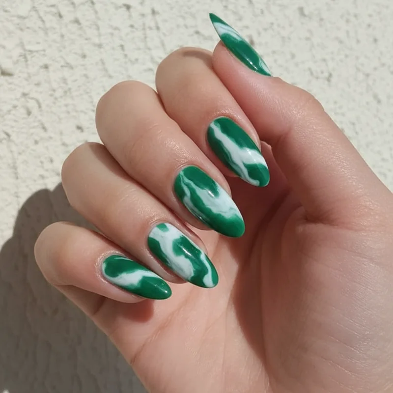 Jade marble nail ideas summer 2026 glossy finish trending on Pinterest with swirled green and white marble pattern nails