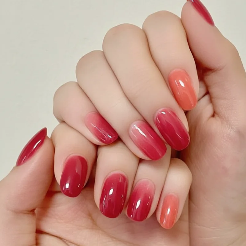 Jelly nails summer 2026 sheer translucent cranberry watermelon and peach finishes showing buildable opacity layers