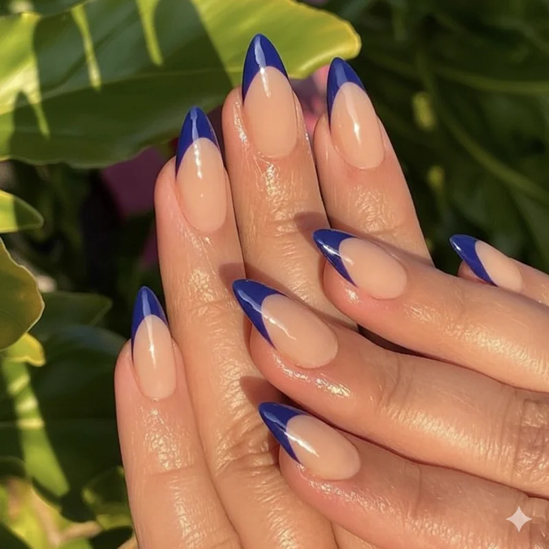 Reverse French tip nails summer 2026 colour at the base bare tip design in cobalt and deep plum on medium nails