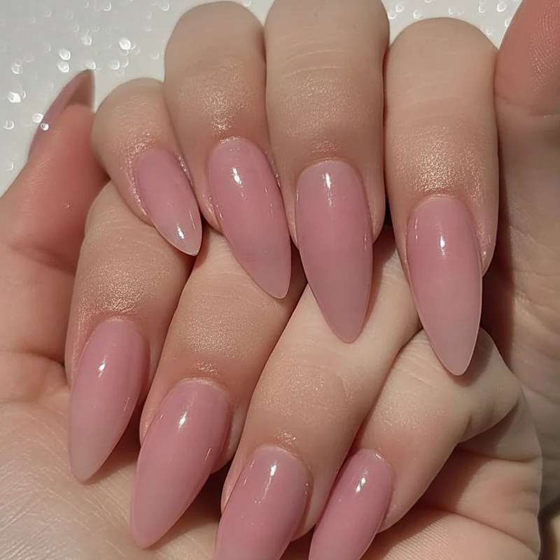 Close-up of syrup nail finish showing wet ultra-glossy surface with natural nail bed visible through translucent layered gel polish coat
