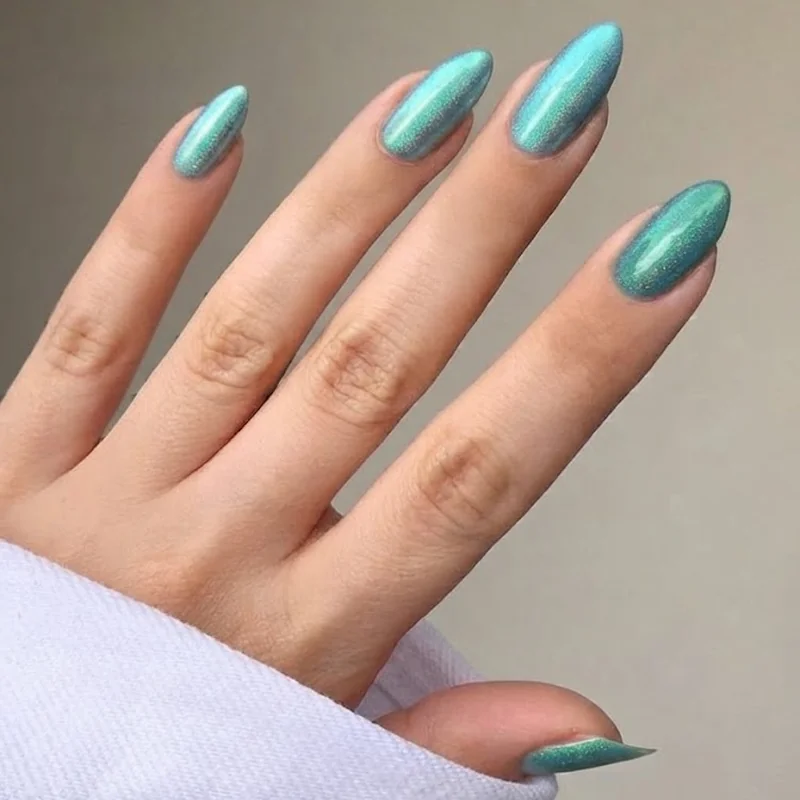 Blue green holographic opalite nail polish closest match to Taylor Swift music video manicure shade
