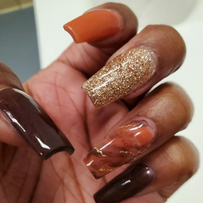 Best thanksgiving nail colors including burgundy burnt orange and gold polish swatches