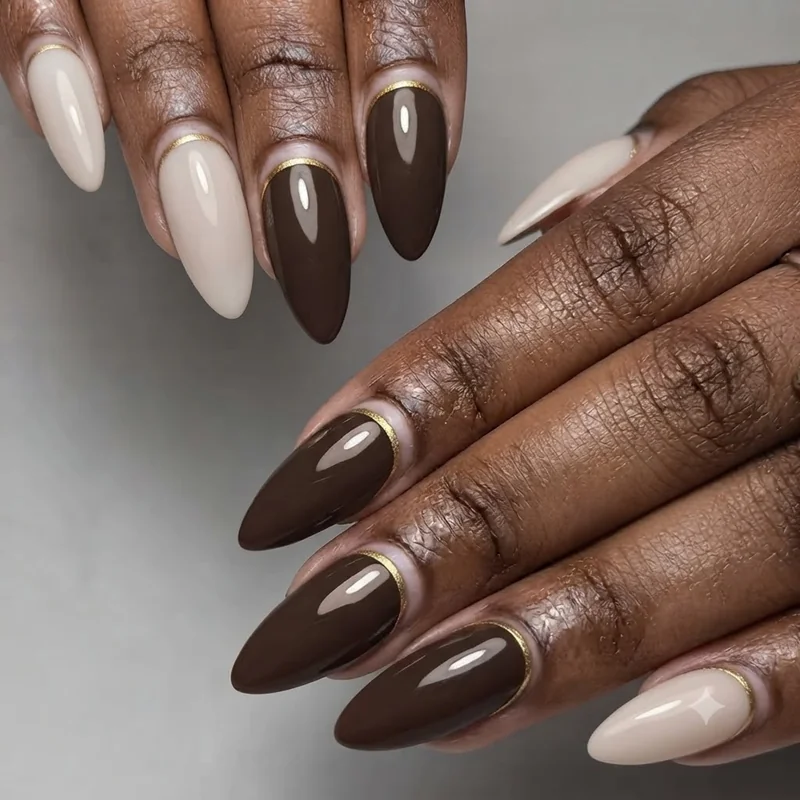 Modern abstract line art turkey nail design in gold outline on milky nude base