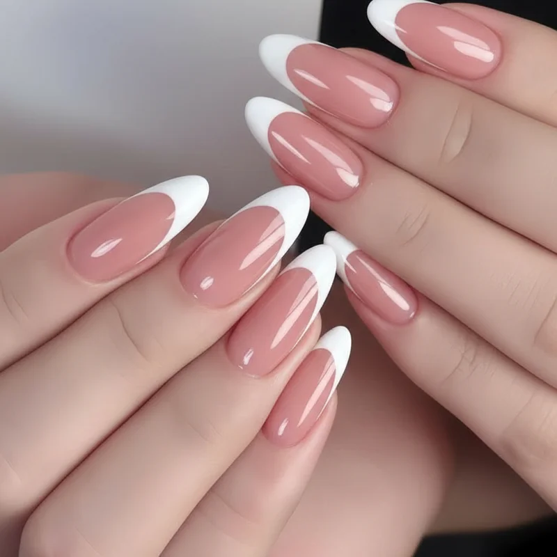 Nail tech applying French tip wedding nails with a precise gel smile line showing correct tip width and warm pink base tone
