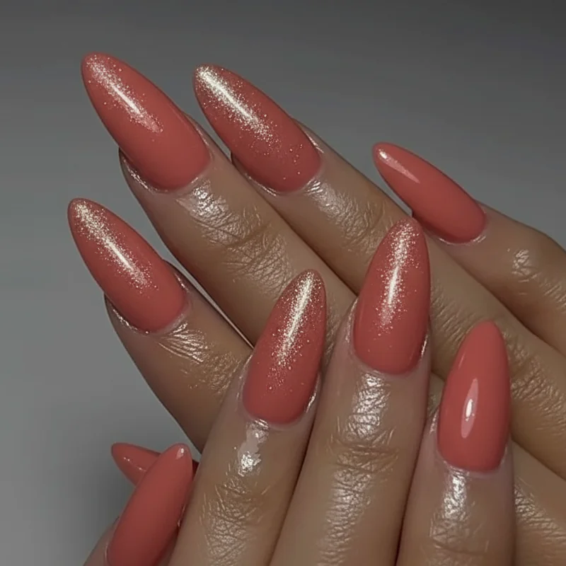 Beach destination wedding guest nails showing durable BIAB gel in warm coral champagne shimmer and terracotta finishes