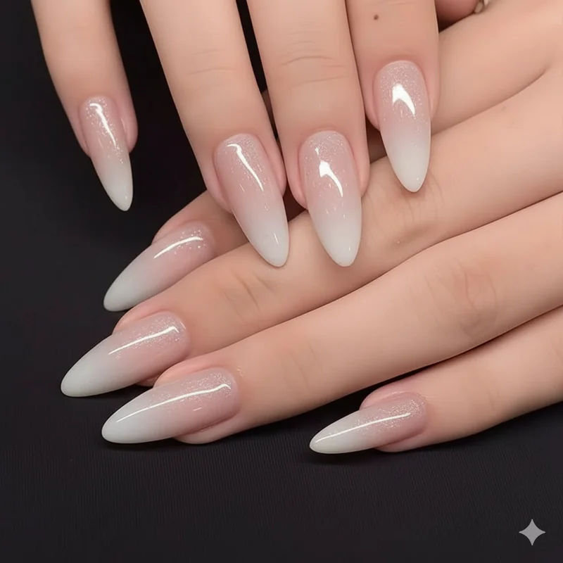 Quiet luxury bridal nail aesthetic 2026 featuring dimensional shimmer glazed finish on almond-shaped natural nails