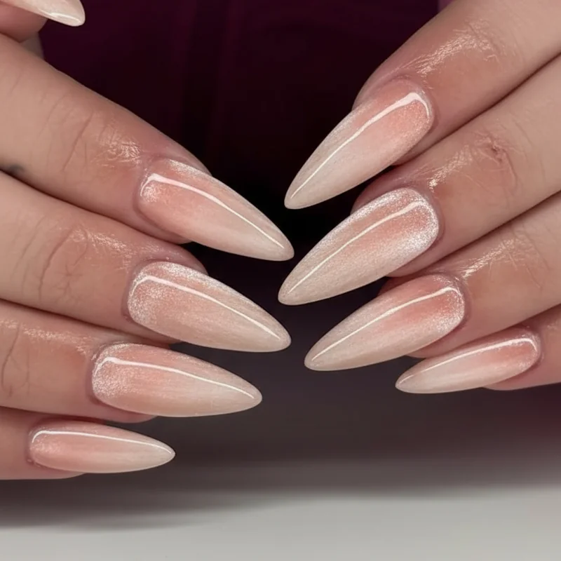 Velvet cat eye bridal nails 2026 in champagne and blush magnetic gel showing soft dimensional glow on almond shape