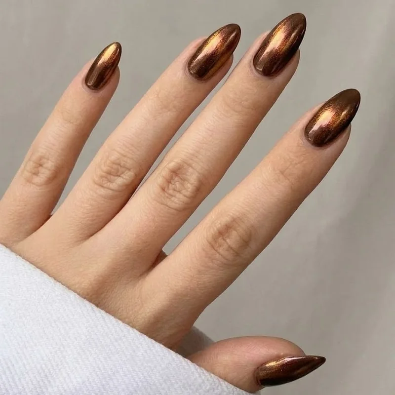 Brown chrome nails with bronze dimensional shimmer, metallic winter finish option