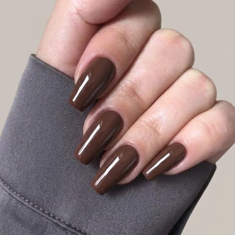 Deep cocoa brown solid gloss on long coffin nails, rich winter chocolate manicure