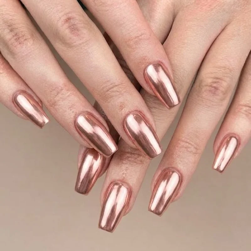 Chrome rose gold coffin nails winter manicure with molten metallic light reflection