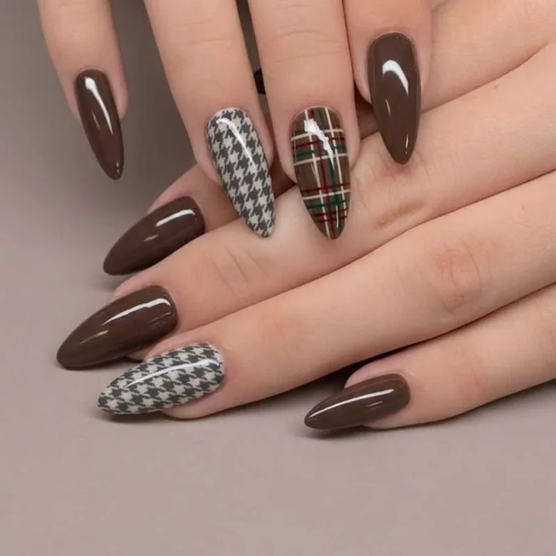Celestial gold foil moon and star nail art detail on dark academia winter manicure