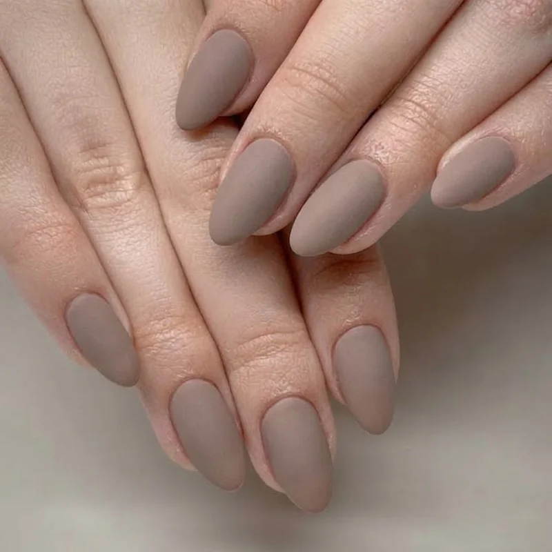 Close up of a fresh flawless matte winter manicure showing properly maintained flat finish