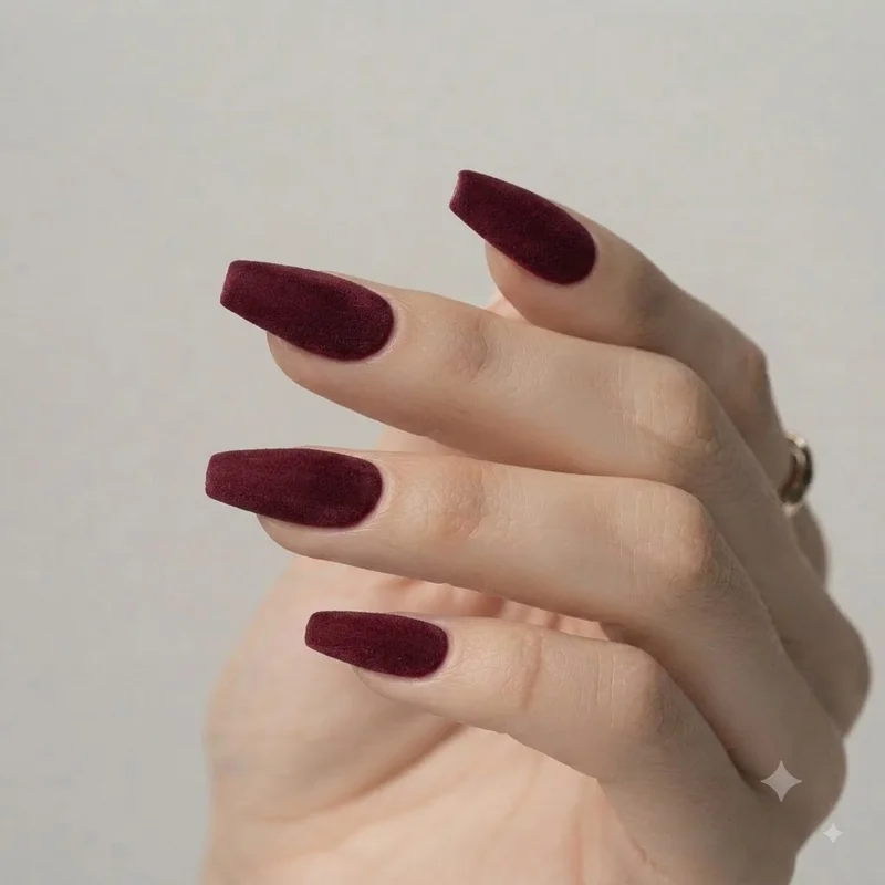 Navy blue nail art with celestial and marble details for a special occasion winter look