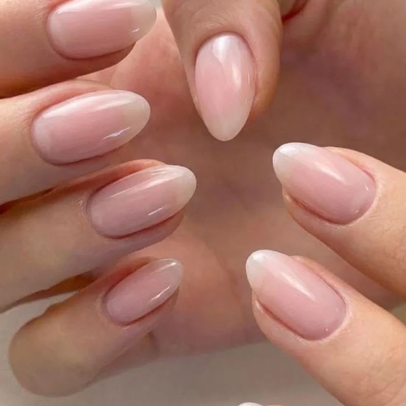 Sheer pink old money winter nails for a wedding guest, glossy short almond shape with refined bridal-adjacent styling