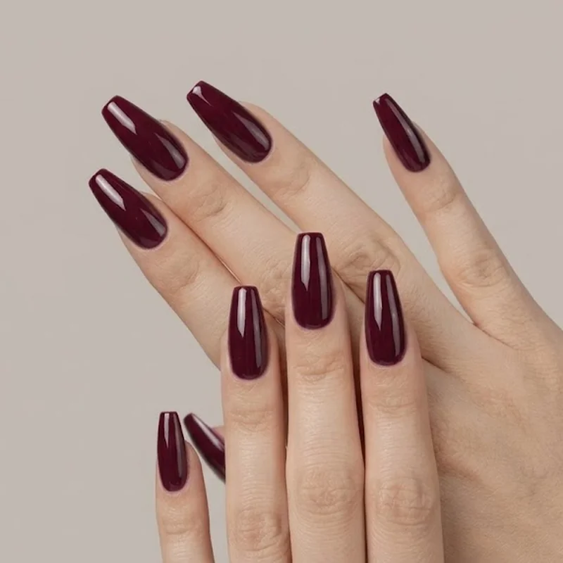 Deep burgundy winter nail colors 2026 manicure with high-gloss gel finish on medium-length nails