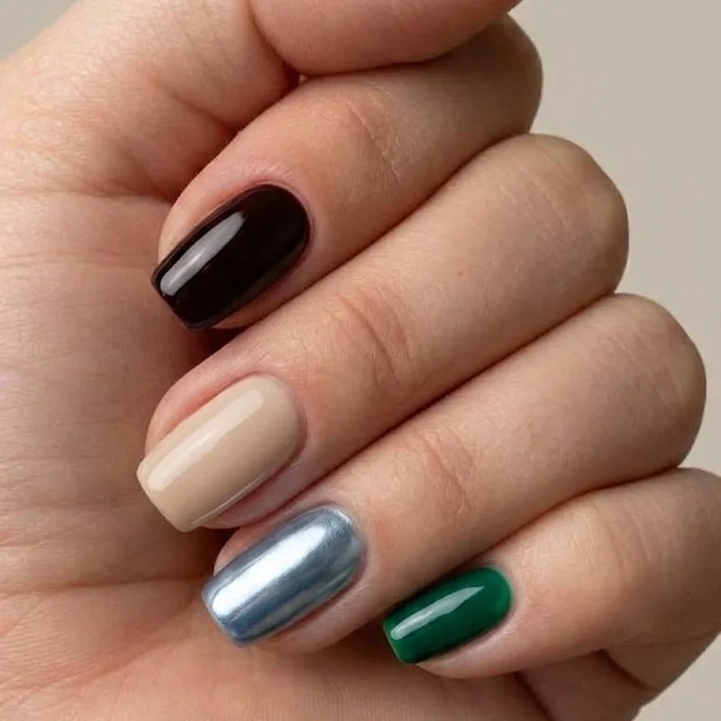 Four winter nail color vibe categories shown together: moody deep, cozy neutral, icy metallic, jewel tone