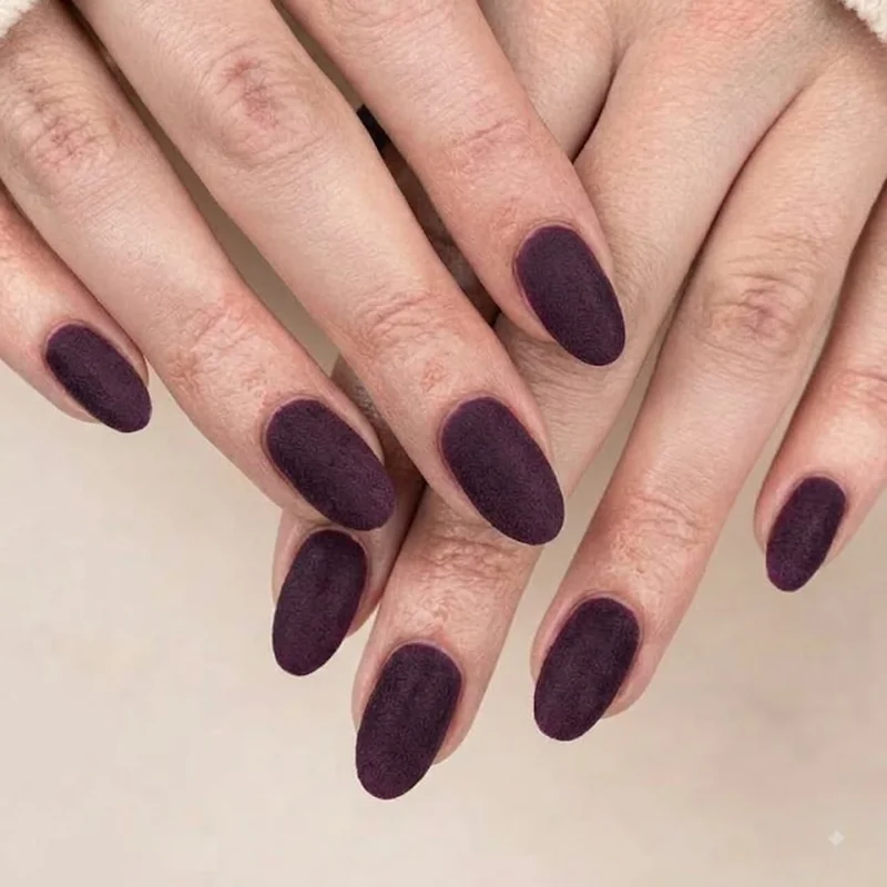 Matte finish winter nail colors 2026 manicure in deep winter shade with soft suede texture